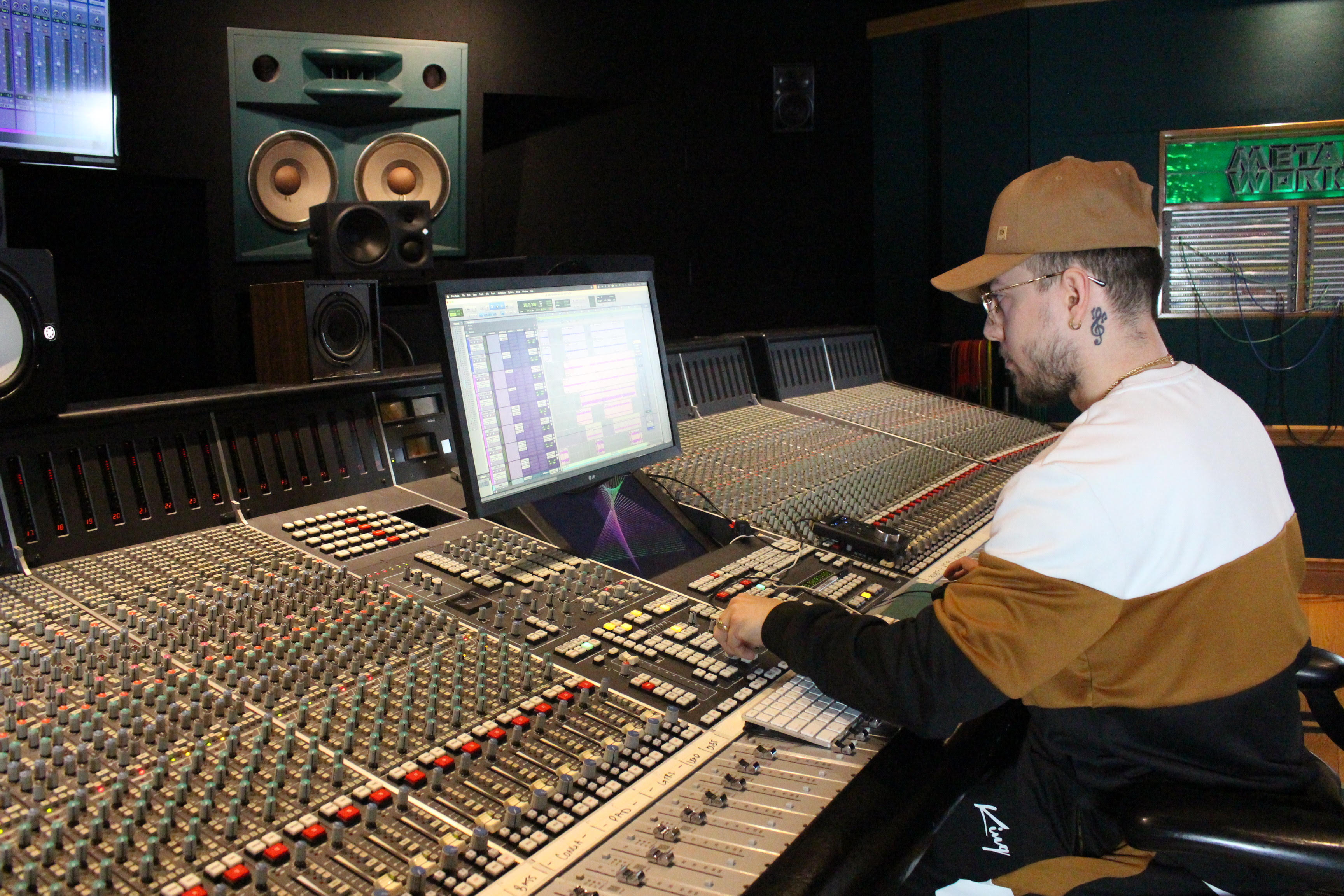 Reisee sitting at a console
