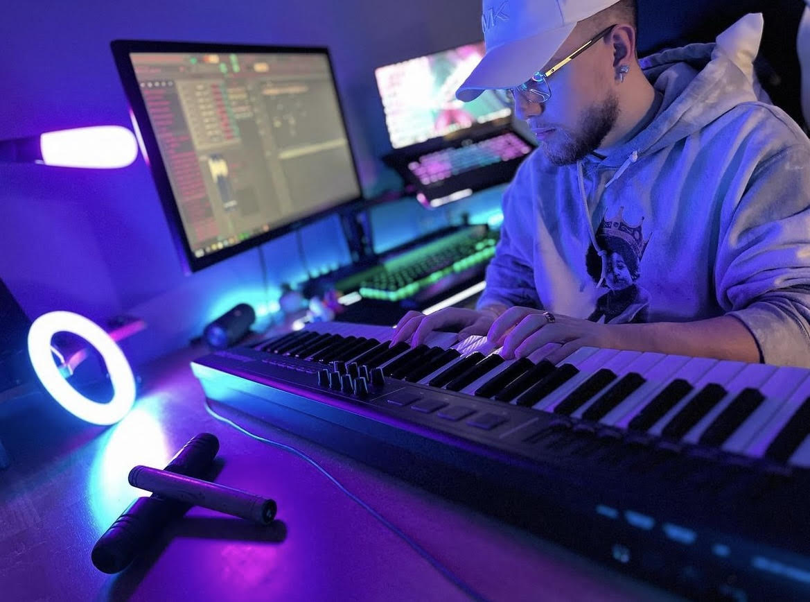 Austin Reis sitting at a piano